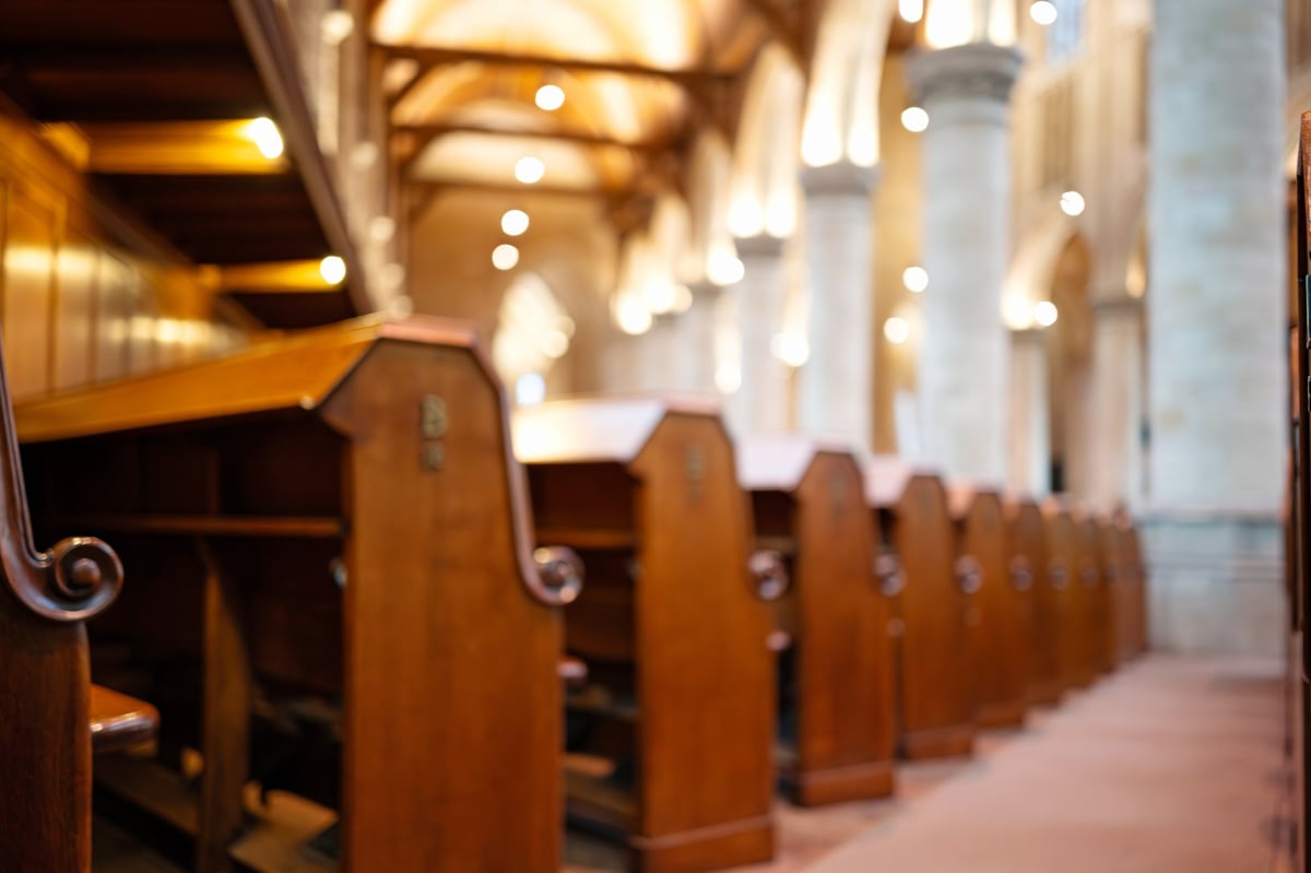 Quiet wooden pews inside a church